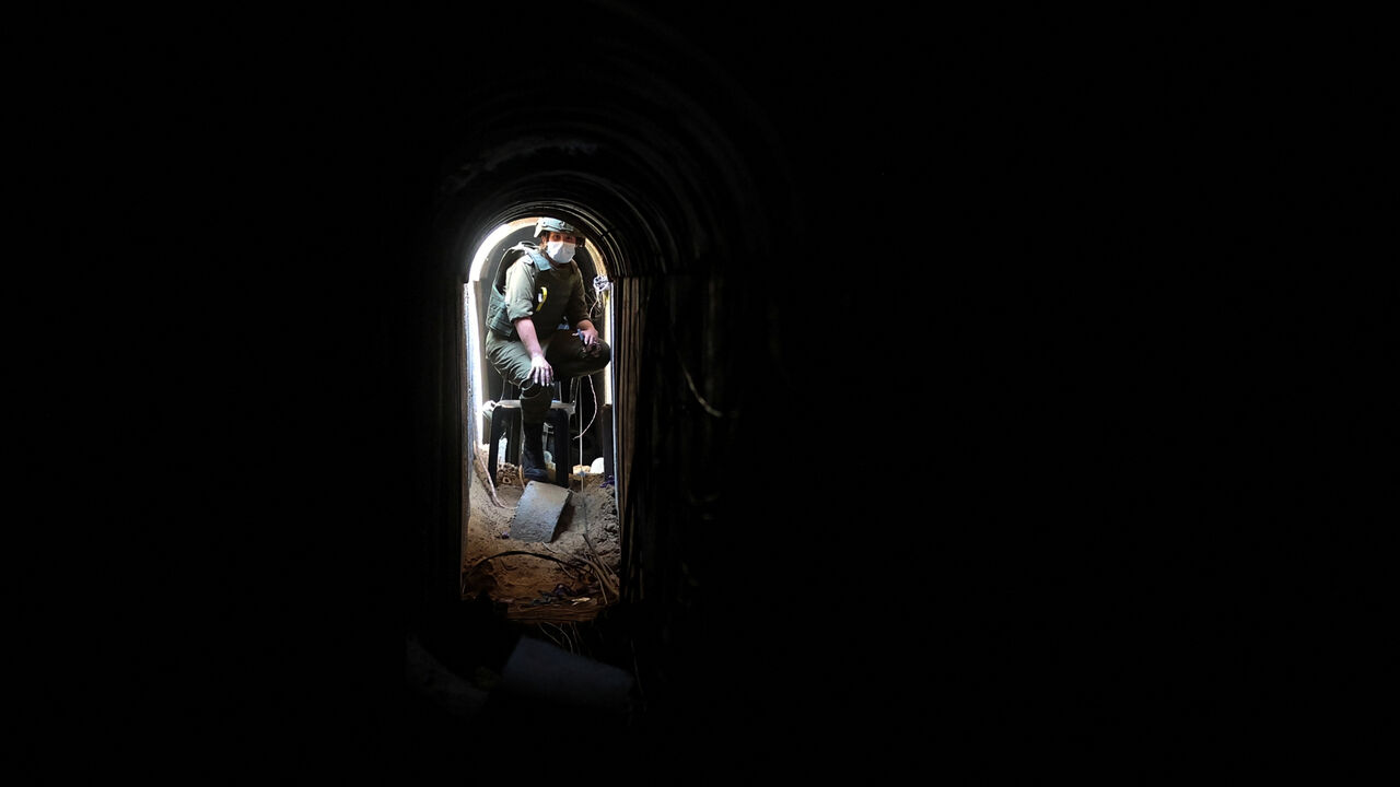 An Israeli soldier sits inside a tunnel underneath the European Hospital in Khan Younis at the Gaza Strip, amid the ongoing ground operation of the Israeli army against Palestinian Islamist group Hamas, June 8, 2025. REUTERS/Ronen Zvulun