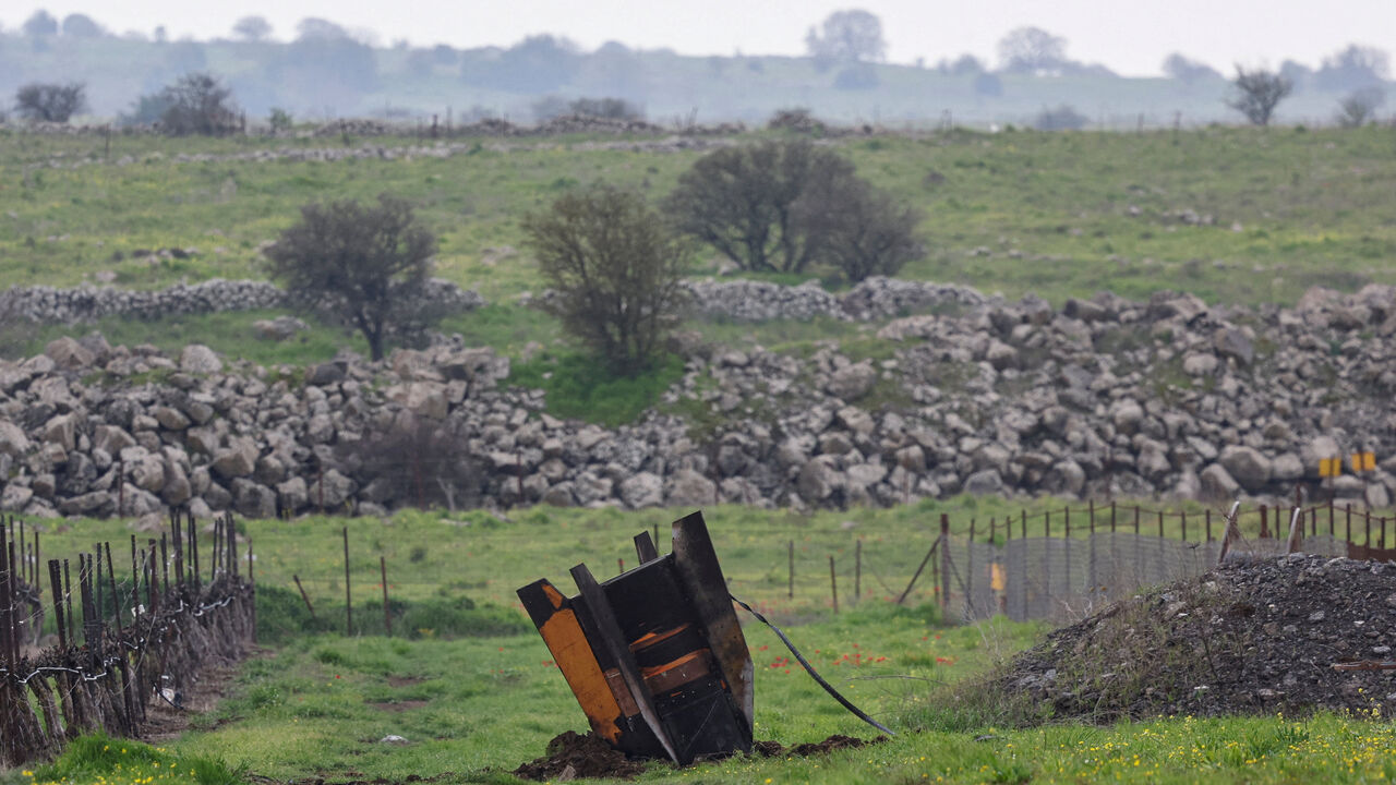 FILE PHOTO: The tail fin of a large missile protrudes from a field, following barrages of missiles from Iran towards Israel, amid the U.S.-Israel conflict with Iran, in the Israeli-occupied Golan Heights March 19, 2026. REUTERS/Tyrone Siu/File Photo
