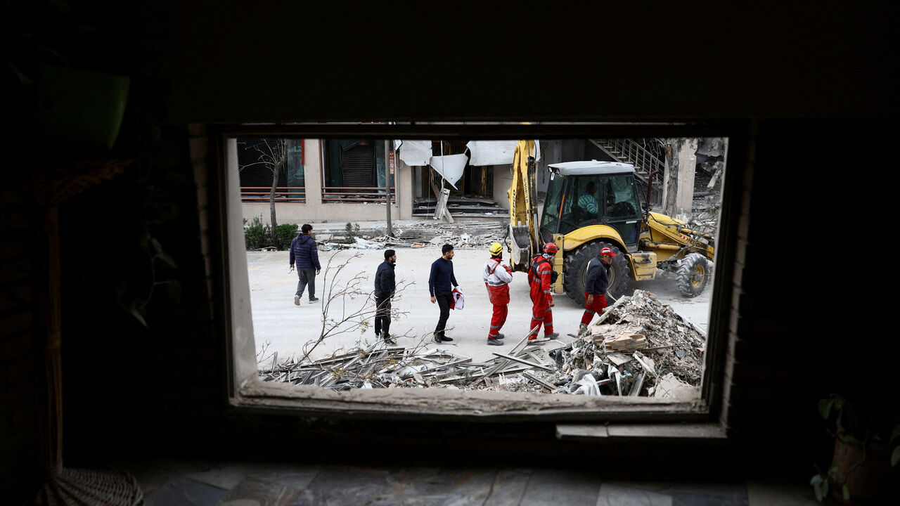 Emergency responders work at a site of the Qatari Al-Araby TV and business building damaged by a strike, as the U.S.-Israeli conflict with Iran continues, in Tehran, Iran, March 29, 2026. Majid Asgaripour/WANA (West Asia News Agency) via REUTERS