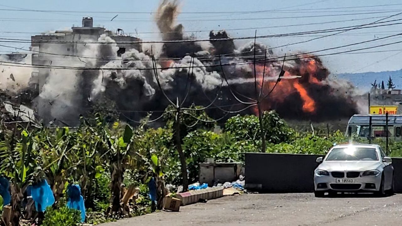 An explosion erupts following an Israeli airstrike on the village of Abbasiyeh in southern Lebanon on March 10, 2026
