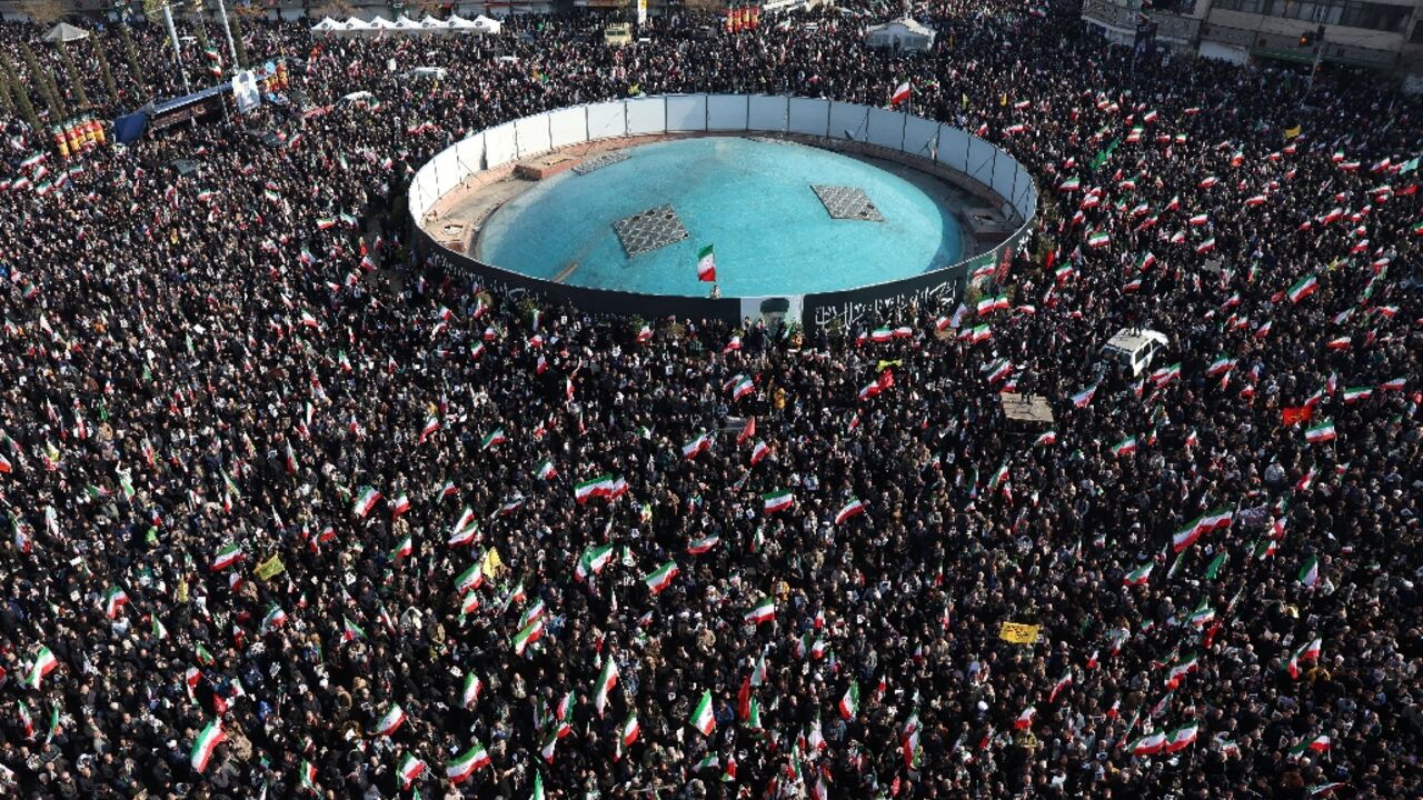 Demonstrators gather for a rally in support of Iran's new supreme leader in central Tehran on Monday