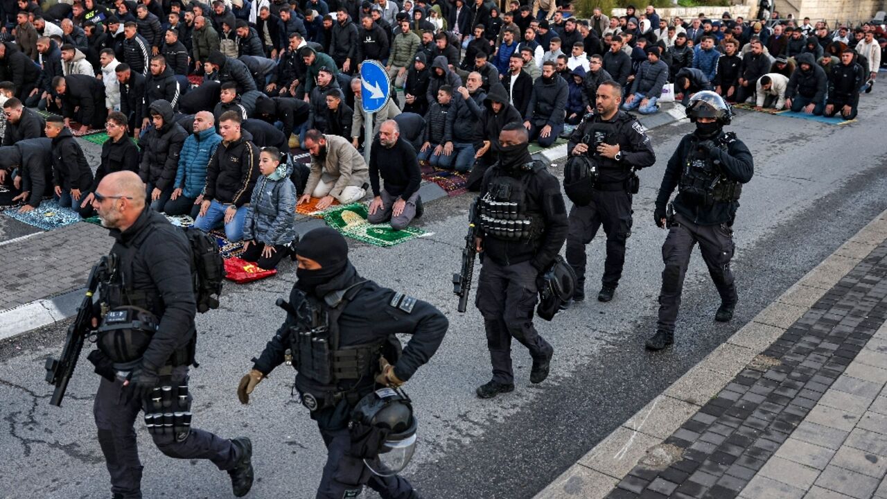 Muslim worshippers prayed at the walls of Jerusalem's Old City to mark the Eid al-Fitr holiday as access is shut for the Al-Aqsa Mosque
