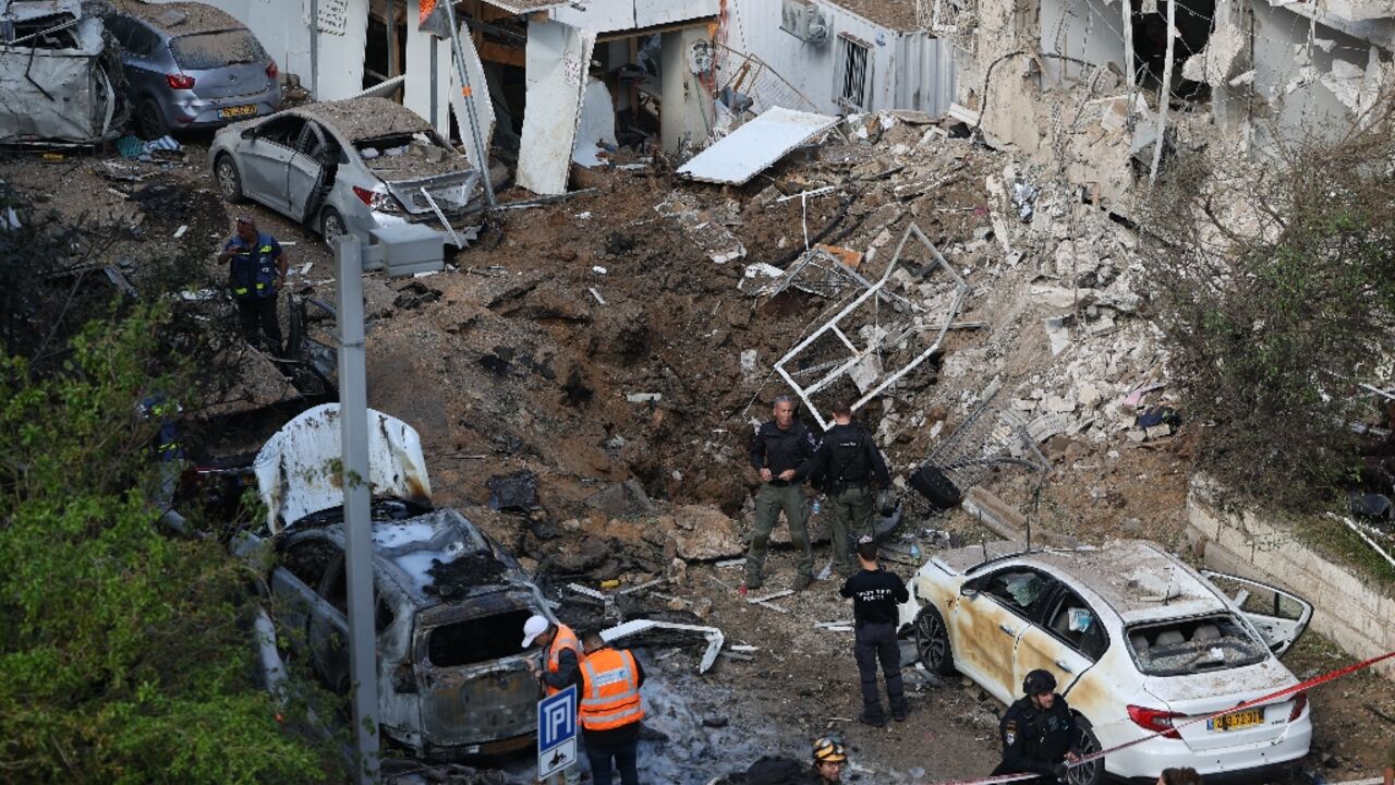 The site of an Iranian missile strike in Tel Aviv on March 24, 2026