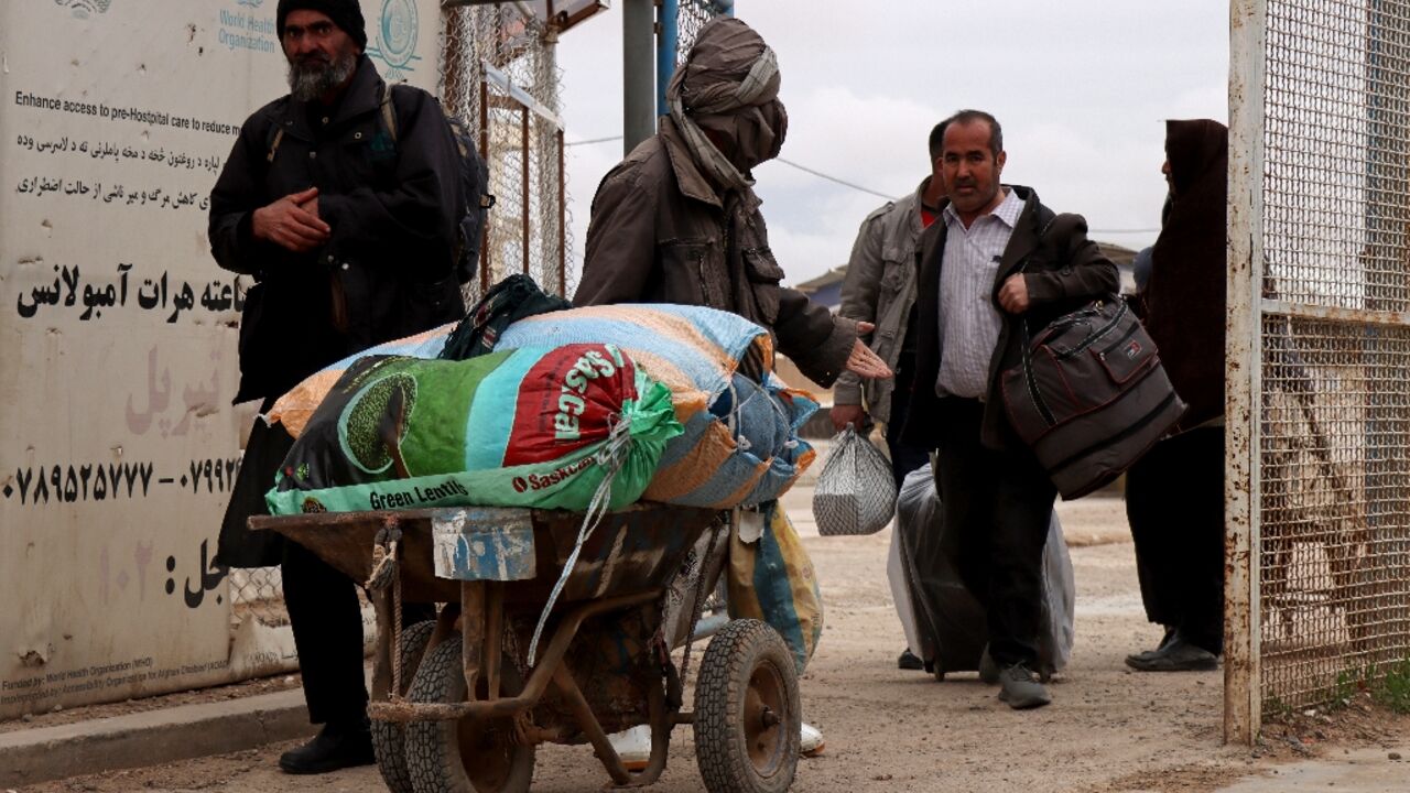 Afghan in Iran must decide between war there or war in their home nation