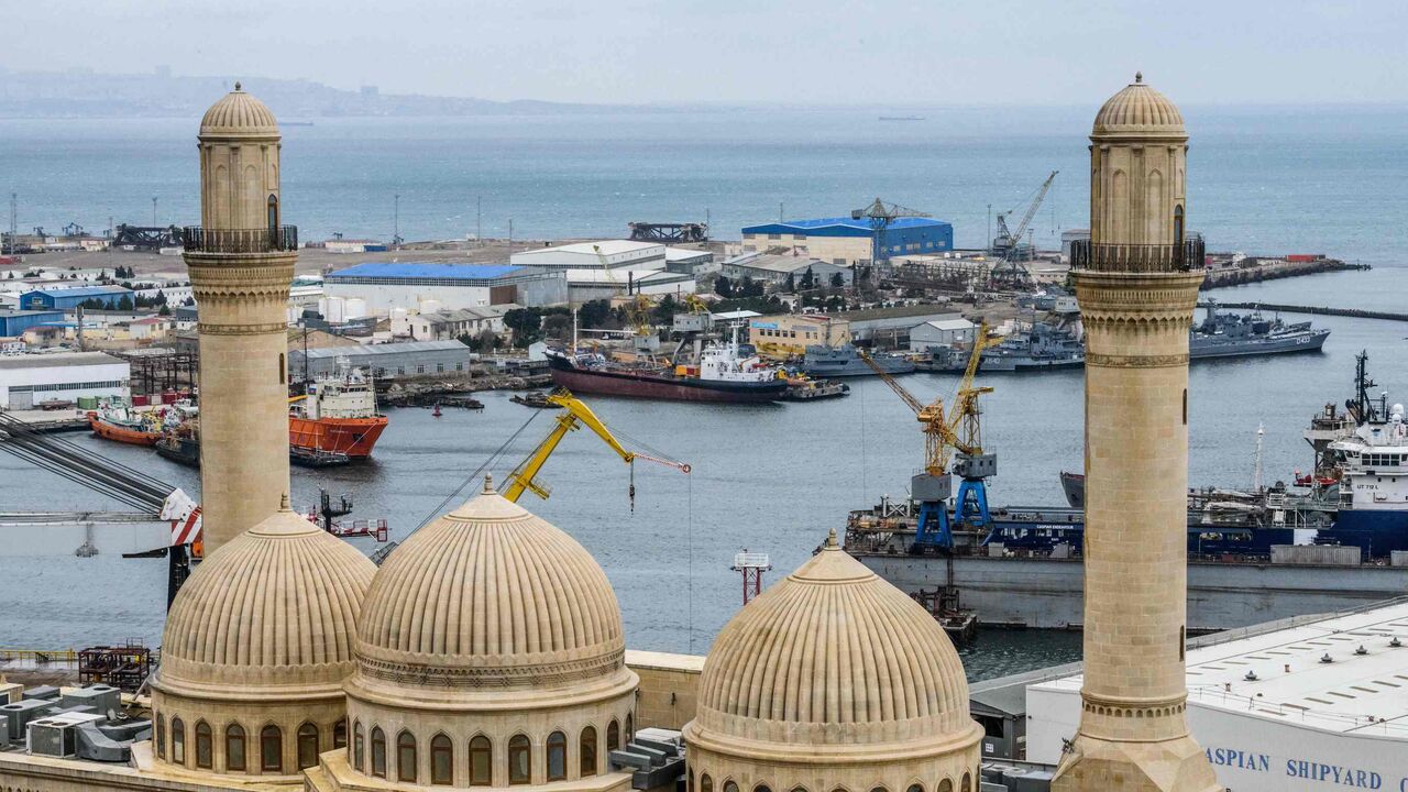Bibi Heybat mosque is seen in front of Bibi Heybat Oil Field, situated at the coast of the Caspian Sea outside Baku on March 19, 2019. 