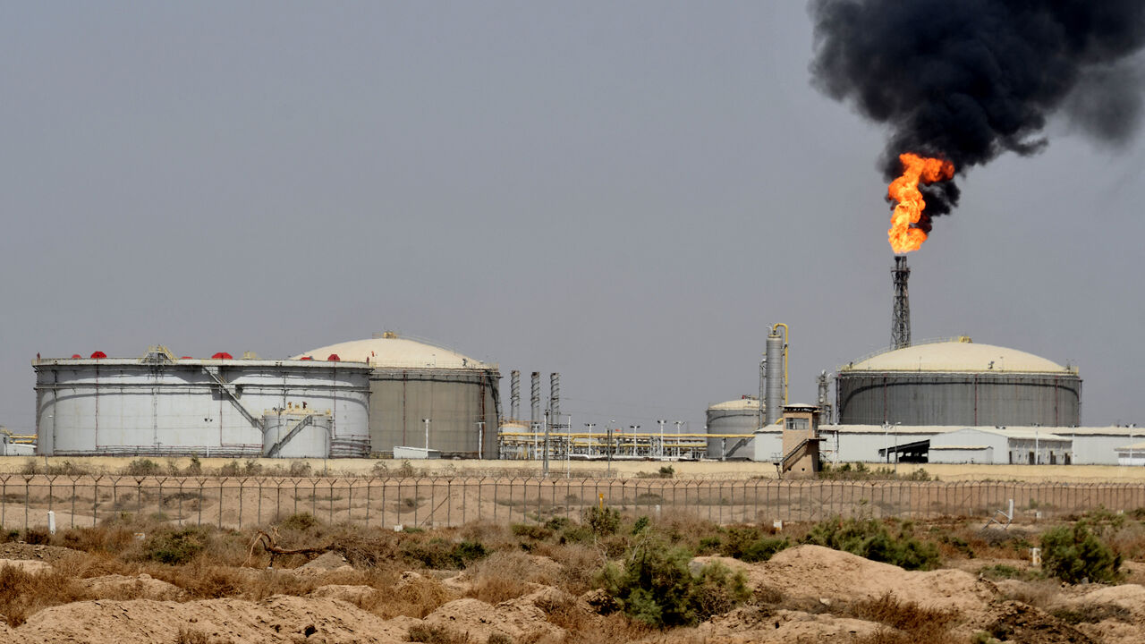 A picture shows smoke billowing from the Central Production Facility 1 gas refinery in Iraq's southern Maysan province on May 29, 2022.