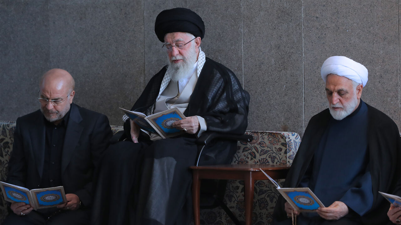 TEHRAN, IRAN - OCTOBER 4: (EDITOR’S NOTE: This Handout image/clip was provided by a third-party organization and may not adhere to Getty Images’ editorial policy.) In this handout image provided by the Iranian Leader's Press Office, Iranian Supreme leader Ali Khamenei (C) with Parliament Speaker Mohammad Bagher Ghalibaf (L) and Judiciary Chief Mohsen Ejeie (R), reading the Koran during the Friday prayer ceremony on October 04, 2024 in Tehran, Iran. Protesters supporting Iran's military position against Isra