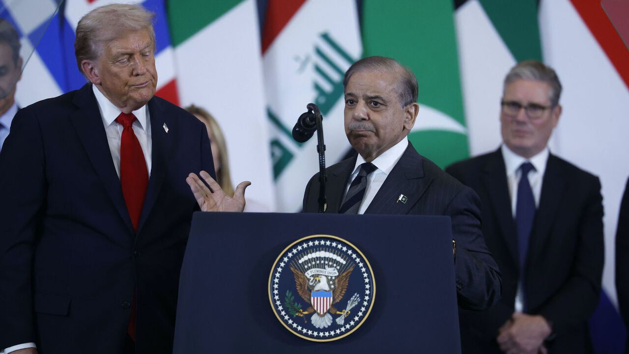 Pakistan's Prime Minister Shehbaz Sharif (C) speaks as US President Donald Trump (L) and Britain's Prime Minister Keir Starmer (R) watch during the Sharm El-Sheikh Peace Summit on Oct. 13, 2025 in Sharm El-Sheikh, Egypt.  