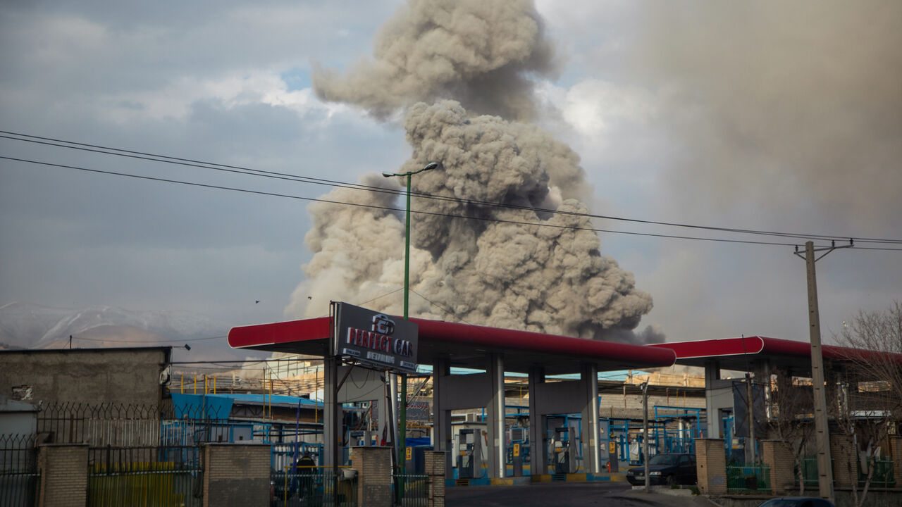 A plume of smoke rises after an explosion on March 2, 2026 in Tehran, Iran. 