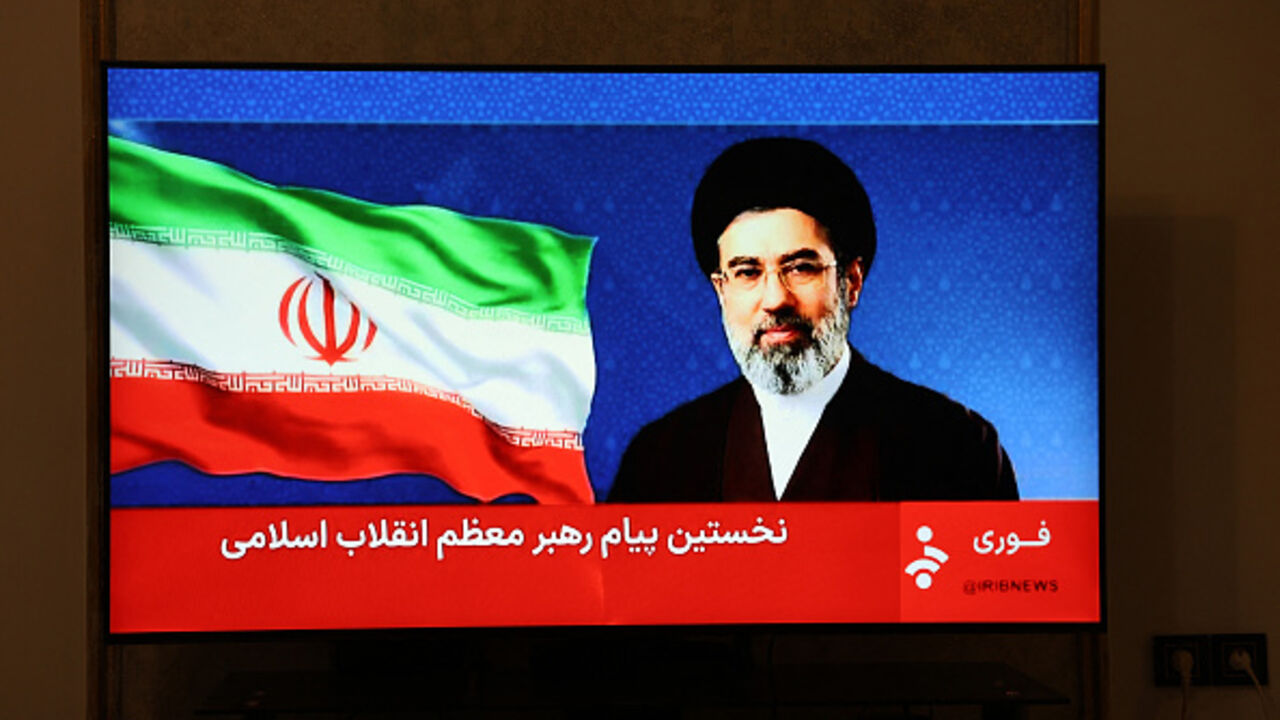 This photo taken in Tehran shows a statement by Iran's new supreme leader Mojtaba Khamenei being televised on March 12, 2026. Iran's new supreme leader ordered the vital Strait of Hormuz oil shipping lane to remain closed on March 12, while US President Donald Trump said stopping the Islamic republic's "evil empire" was more important than crude prices. Ayatollah Mojtaba Khamenei, who was reportedly injured in an air strike, has yet to appear publicly since his nomination as supreme leader, and his defiant 