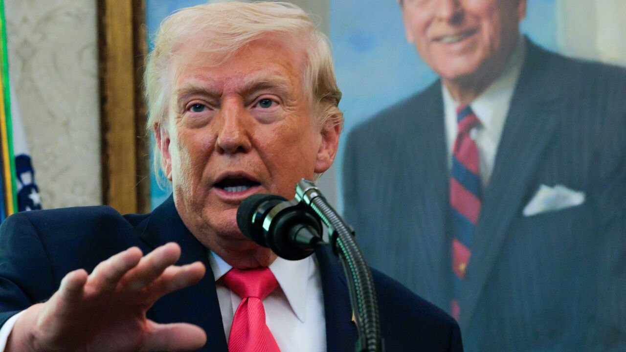 President Donald Trump takes questions during a ceremony for newly sworn in US Secretary of the Department of Homeland Security Markwayne Mullin in the Oval Office at the White House on March 24, 2026 in Washington, DC.  