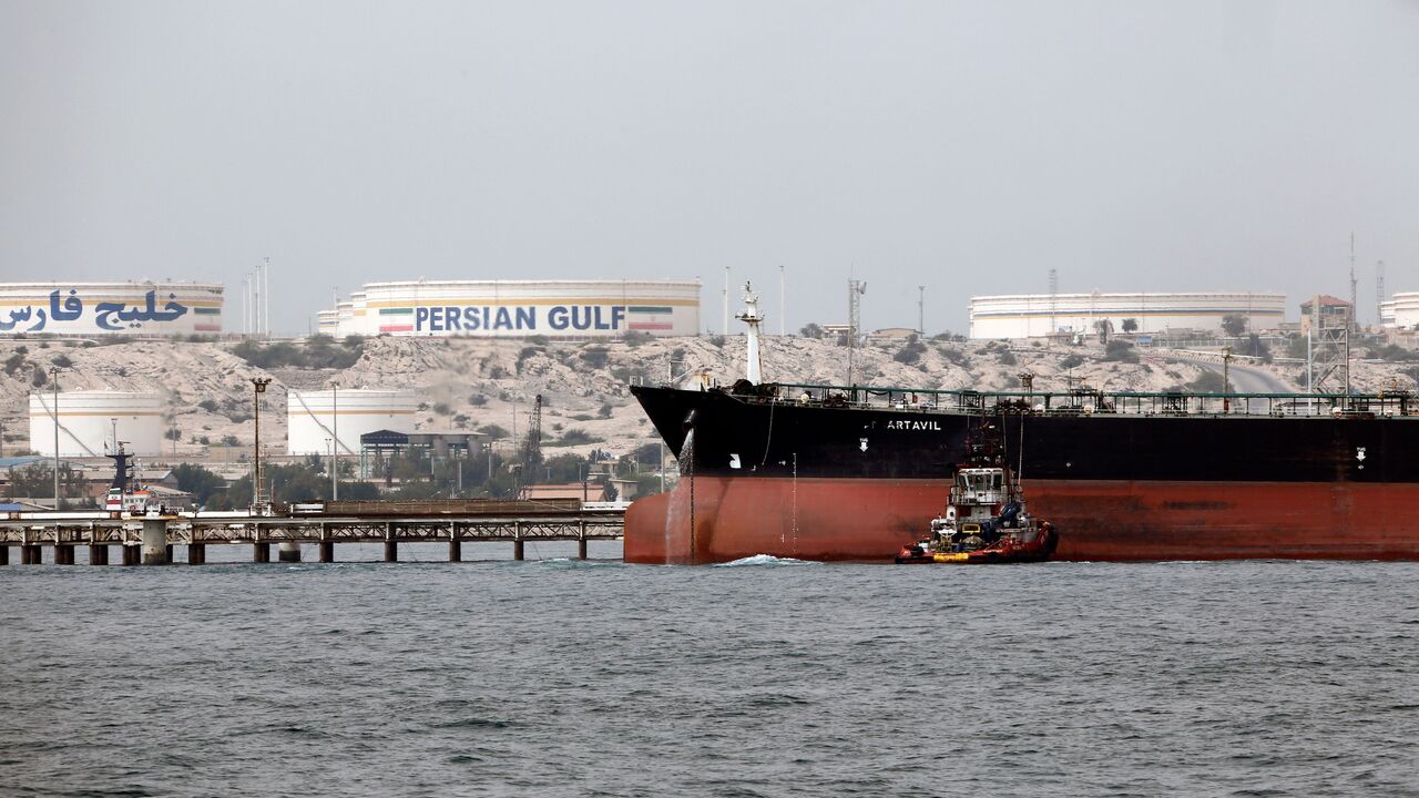 A picture taken on March 12, 2017, shows an Iranian tanker docking at the platform of the oil facility in the Khark Island, on the shore of the Gulf.