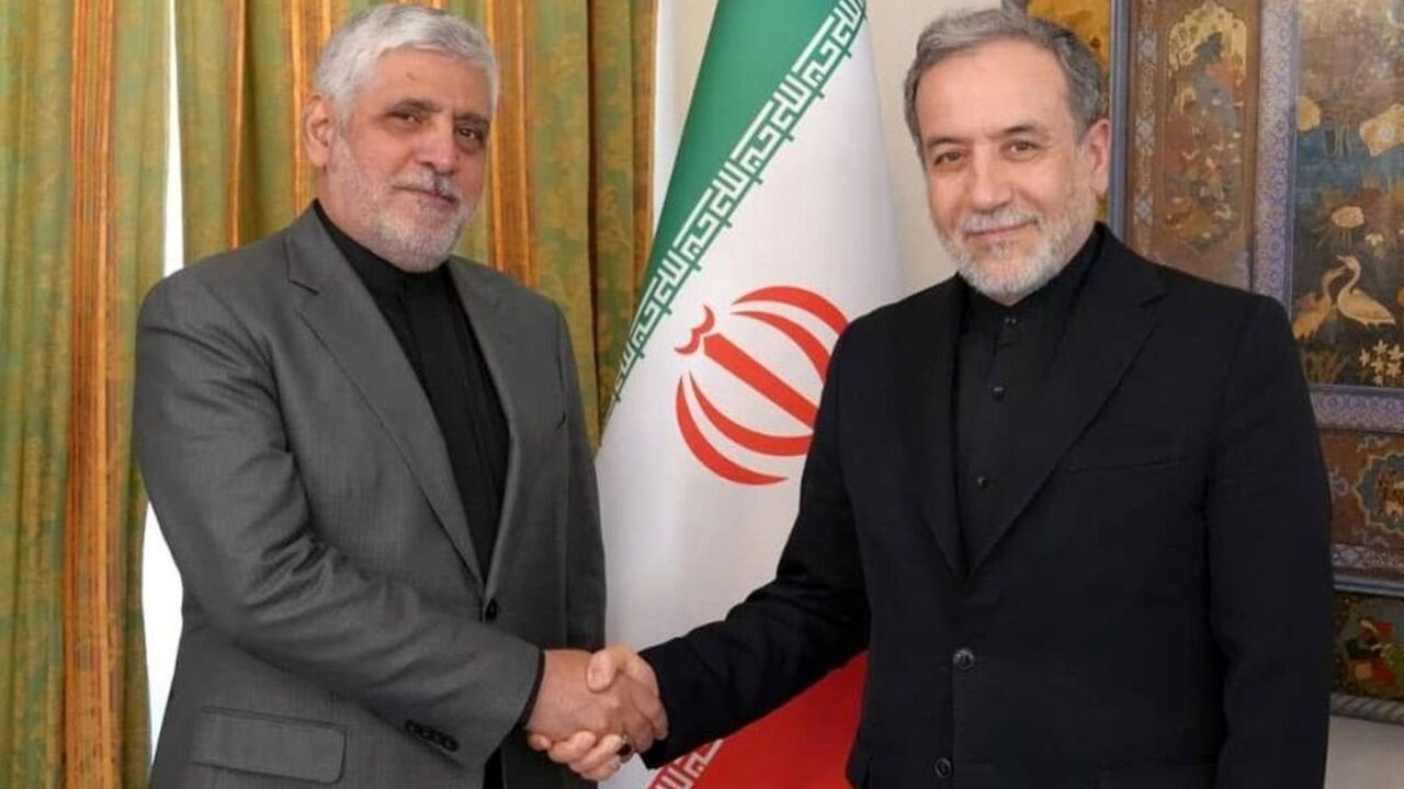 Iran’s ambassador to Beirut, Mohammad Reza Sheibani (L), shakes hands with Iranian Foreign Minister Abbas Araghchi in an undated photo. — X