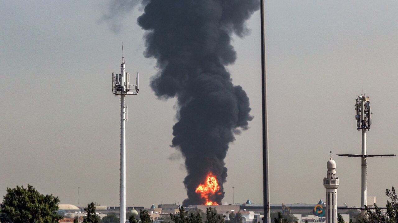 Smoke rises from a fire near Dubai International Airport after a 'drone-related incident'