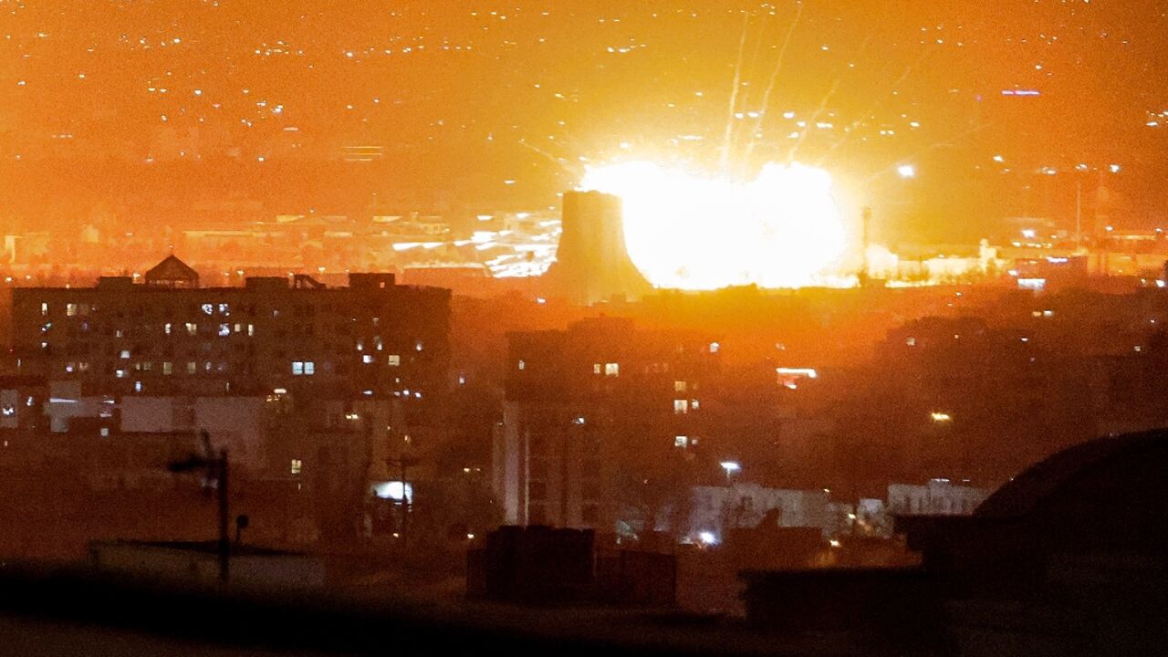 An explosion erupts after strikes near Mehrabad International Airport in Tehran on Saturday