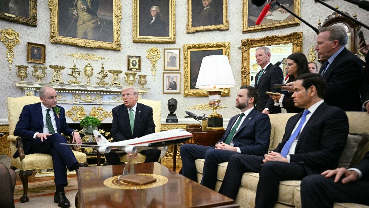 US President Donald Trump spoke about Iran while hosting Irish Taoiseach Micheal Martin (L)