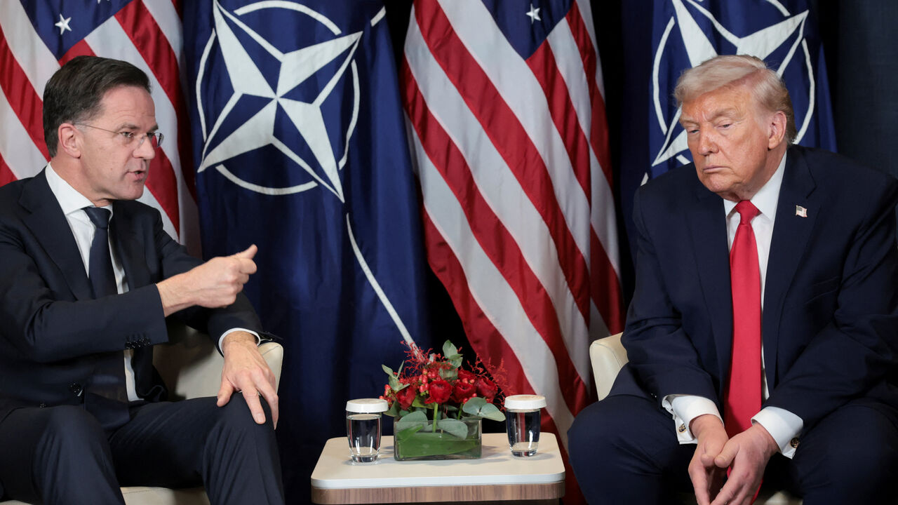 FILE PHOTO: U.S. President Donald Trump holds a bilateral meeting with NATO Secretary General Mark Rutte at the World Economic Forum (WEF) in Davos, Switzerland, January 21, 2026. REUTERS/Jonathan Ernst/File Photo