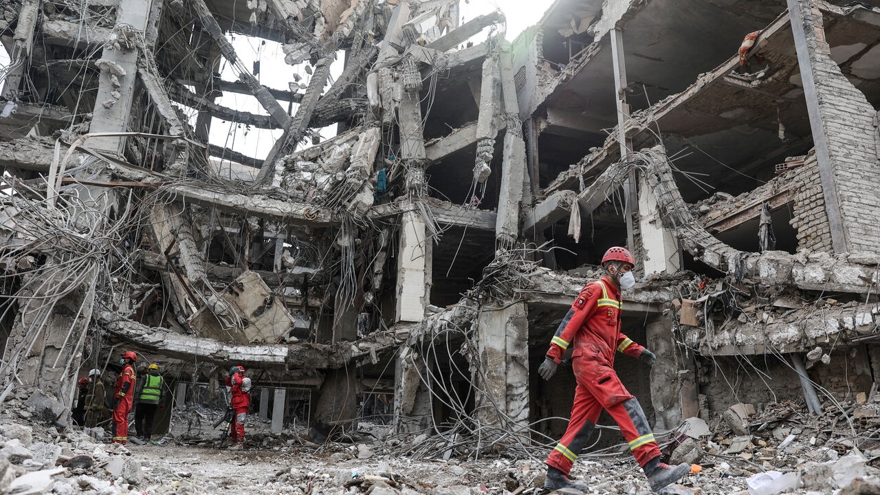 Emergency personnel work at the site of a strike, amid the U.S.-Israeli conflict with Iran, in Tehran, Iran, March 12, 2026. Majid Asgaripour/WANA (West Asia News Agency) via REUTERS