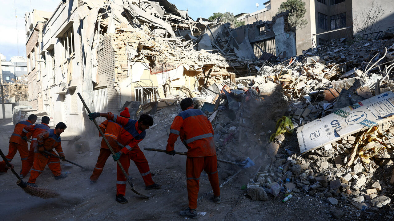 People clear rubble of a Synagogue, which was damaged in a strike, from a street, amid the U.S.-Israeli conflict with Iran, in Tehran, Iran, April 7, 2026. Majid Asgaripour/WANA