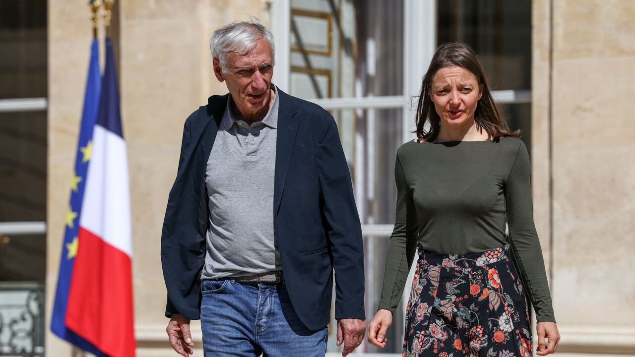 Jacques Paris and Cecile Kohler, French nationals who were freed by Iran after three and a half years in detention, walk at the Elysee Palace as they are hosted by French President Emmanuel Macron, in Paris, France, April 8, 2026. REUTERS/Tom Nicholson/Pool