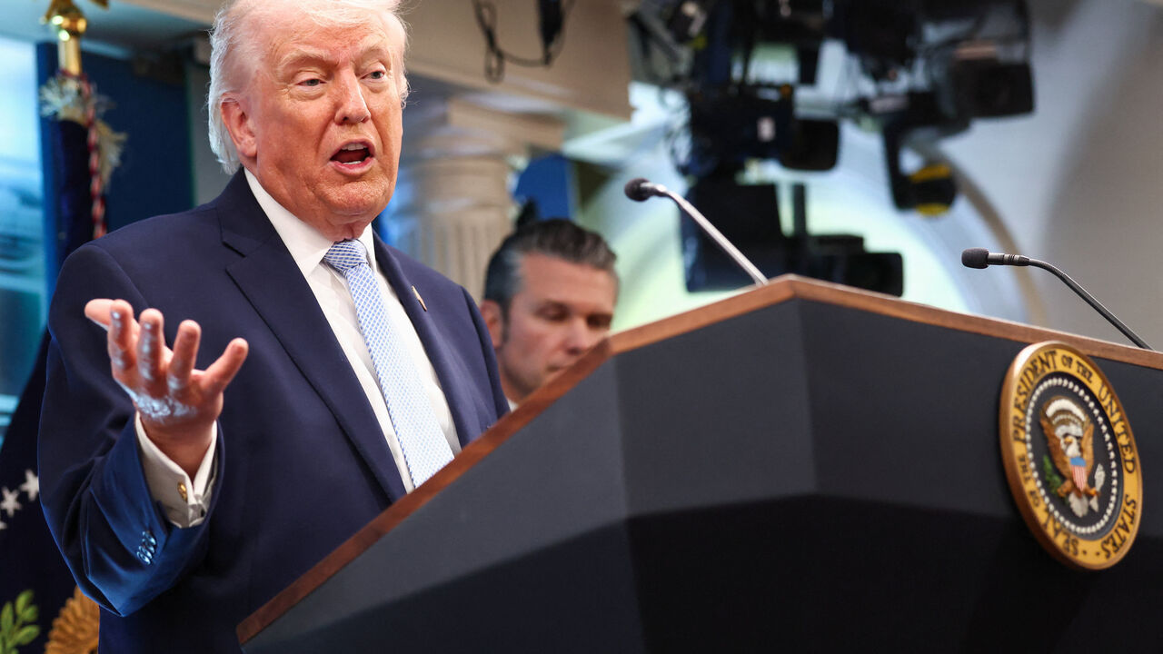 U.S. President Donald Trump, flanked by Secretary of Defense Pete Hegseth, speaks during a press conference in the James S. Brady Press Briefing Room at the White House in Washington, D.C., U.S., April 6, 2026. REUTERS/Kevin Lamarque