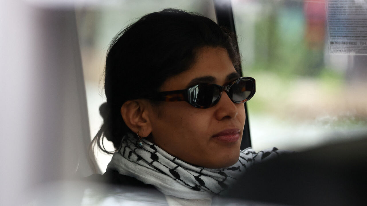 Member of the European Parliament, Rima Hassan of the French far-left opposition party La France Insoumise (France Unbowed - LFI), sits in a vehicle as she leaves after a hearing at the Paris judicial police offices, in Paris, France, April 3, 2026. REUTERS/Tom Nicholson
