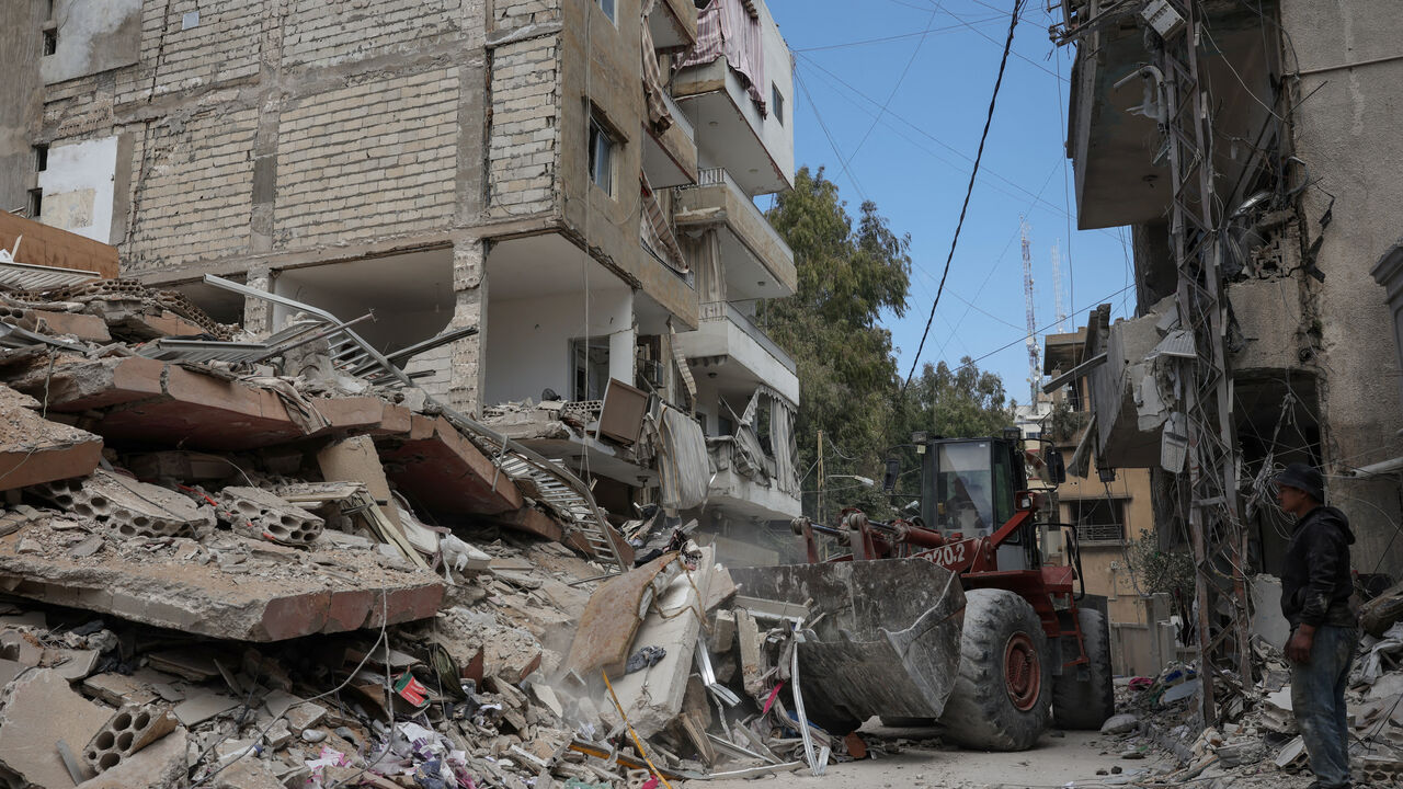 A bulldozer works at the site of last wednesday's Israeli strike, in Tyre, Lebanon, April 10, 2026. REUTERS/Louisa Gouliamaki