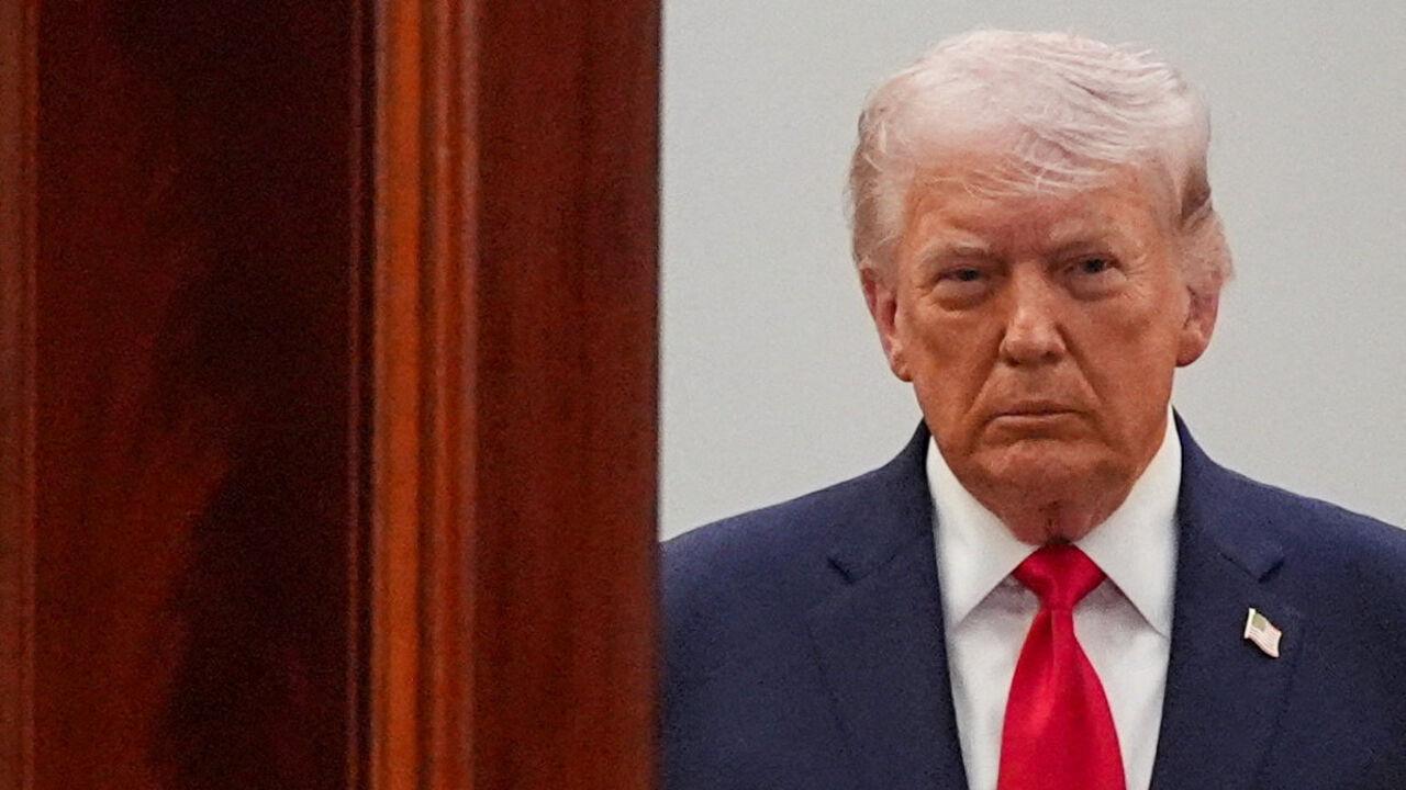 FILE PHOTO: President Donald Trump arrives from the Blue Room to speak about the Iran war from the Cross Hall of the White House on Wednesday, April 1, 2026, in Washington.     Alex Brandon/Pool via REUTERS/File Photo