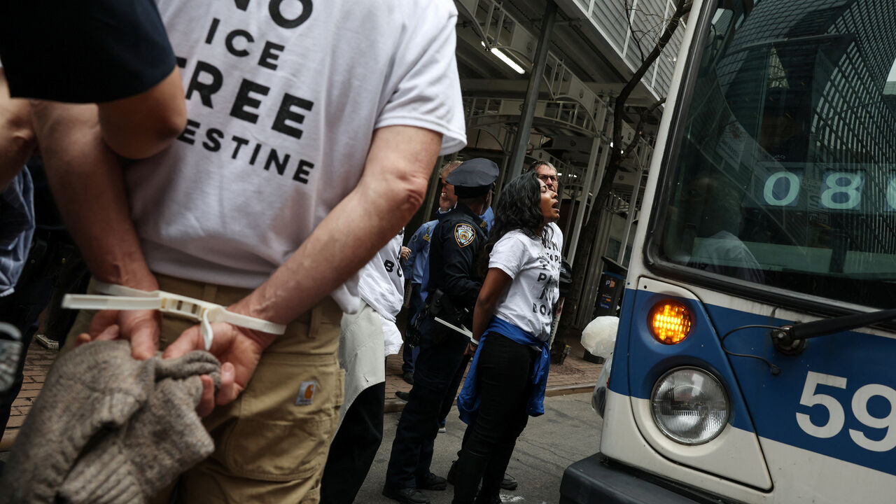 NYPD officers detain a demonstrator during a protest, amid a two-week ceasefire in the U.S.-Israeli conflict with Iran, along Third Avenue in the Midtown area of New York City, U.S., April 13, 2026. REUTERS/Shannon Stapleton