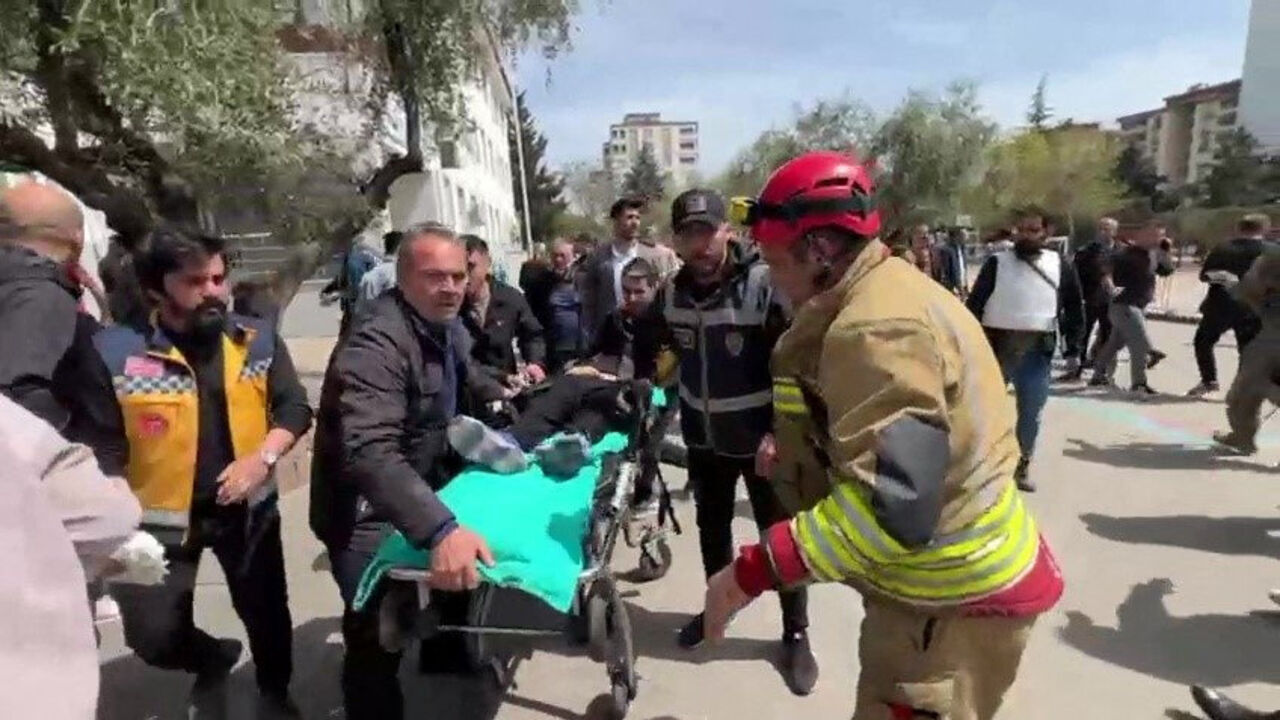 An injured person is carried to an ambulance following a school shooting, in the southeastern province of Kahramanmaras, Turkey, April 15, 2026. IHA (Ihlas News Agency) via REUTERS