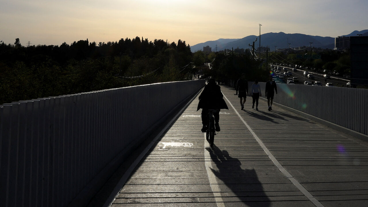Iranians enjoy a sunny day, amid a two-week ceasefire in the U.S.-Israeli conflict with Iran, in Tehran, Iran, April 14, 2026. REUTERS/Thaier Al Sudani