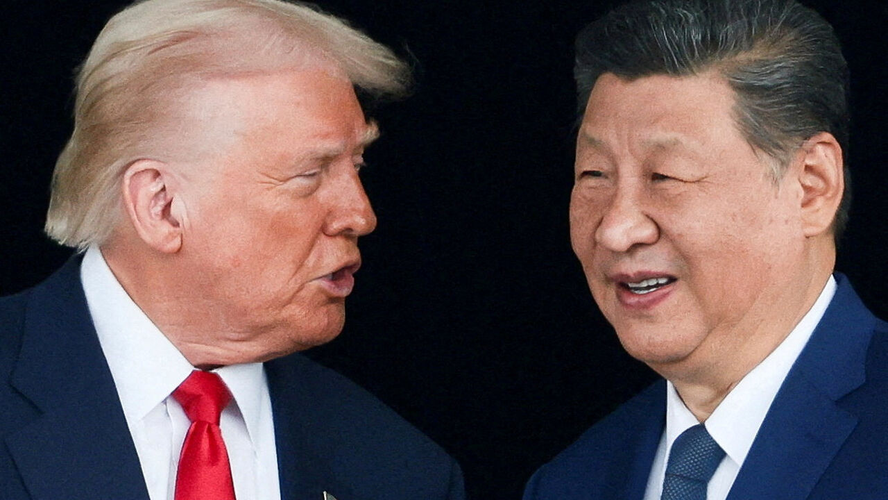 FILE PHOTO: U.S. President Donald Trump and Chinese President Xi Jinping talk as they leave after a bilateral meeting at Gimhae International Airport, on the sidelines of the Asia-Pacific Economic Cooperation (APEC) summit, in Busan, South Korea, October 30, 2025. REUTERS/Evelyn Hockstein/File Photo