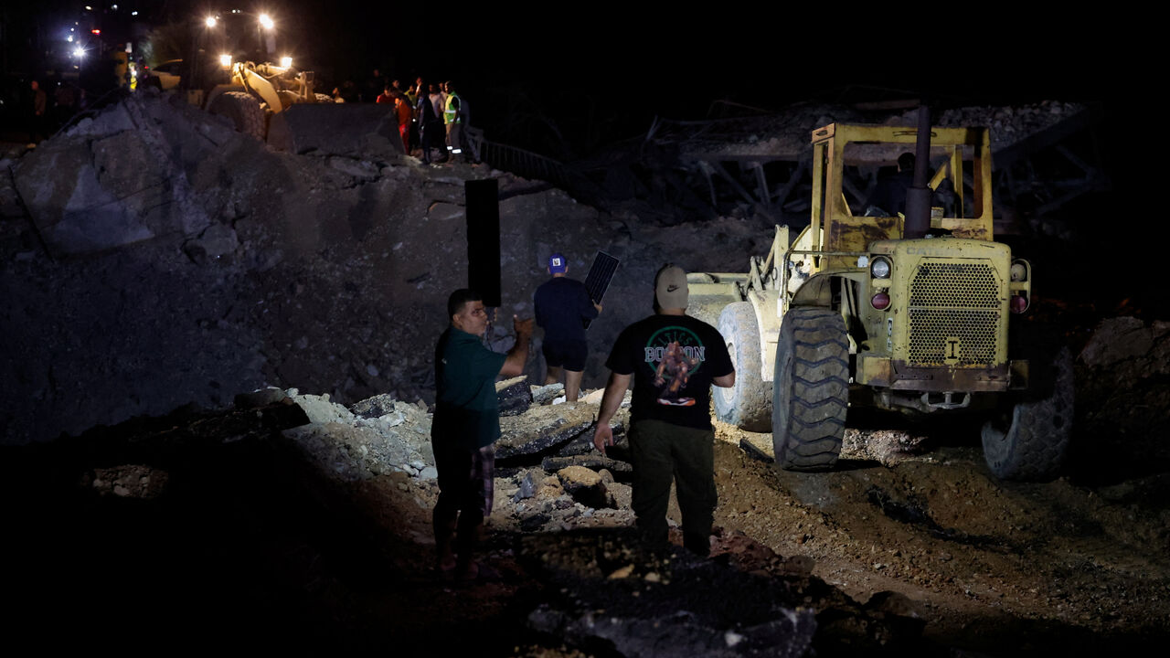 People work to repair the bridge linking southern Lebanon to the rest of the country, which was hit earlier in an Israeli strike, after a 10-day ceasefire between Lebanon and Israel went into effect, in Qasmiyeh, Lebanon, April 17, 2026. REUTERS/Louisa Gouliamaki     TPX IMAGES OF THE DAY