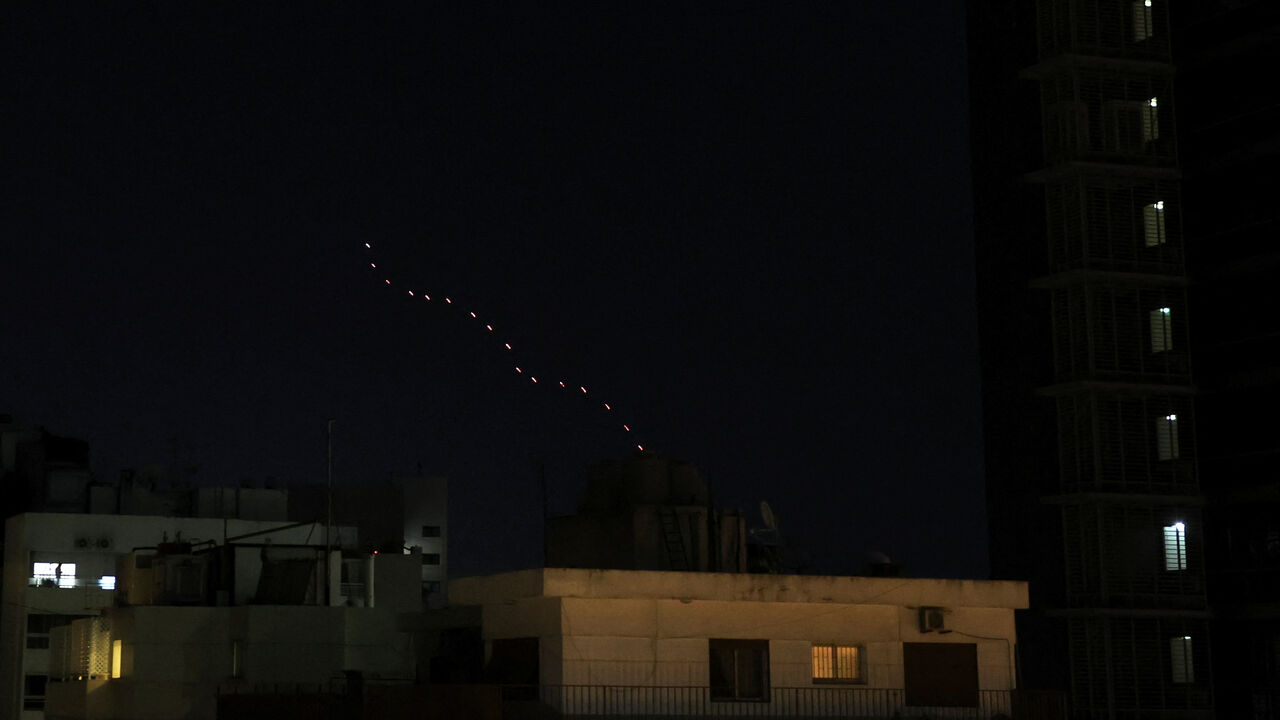 Streaks of tracer fire illuminate the sky as people celebrate after U.S. President Donald Trump said that Israel and Lebanon agreed to a 10-day ceasefire, as seen from Beirut, Lebanon, April 17, 2026. REUTERS/Saleh Salem     TPX IMAGES OF THE DAY