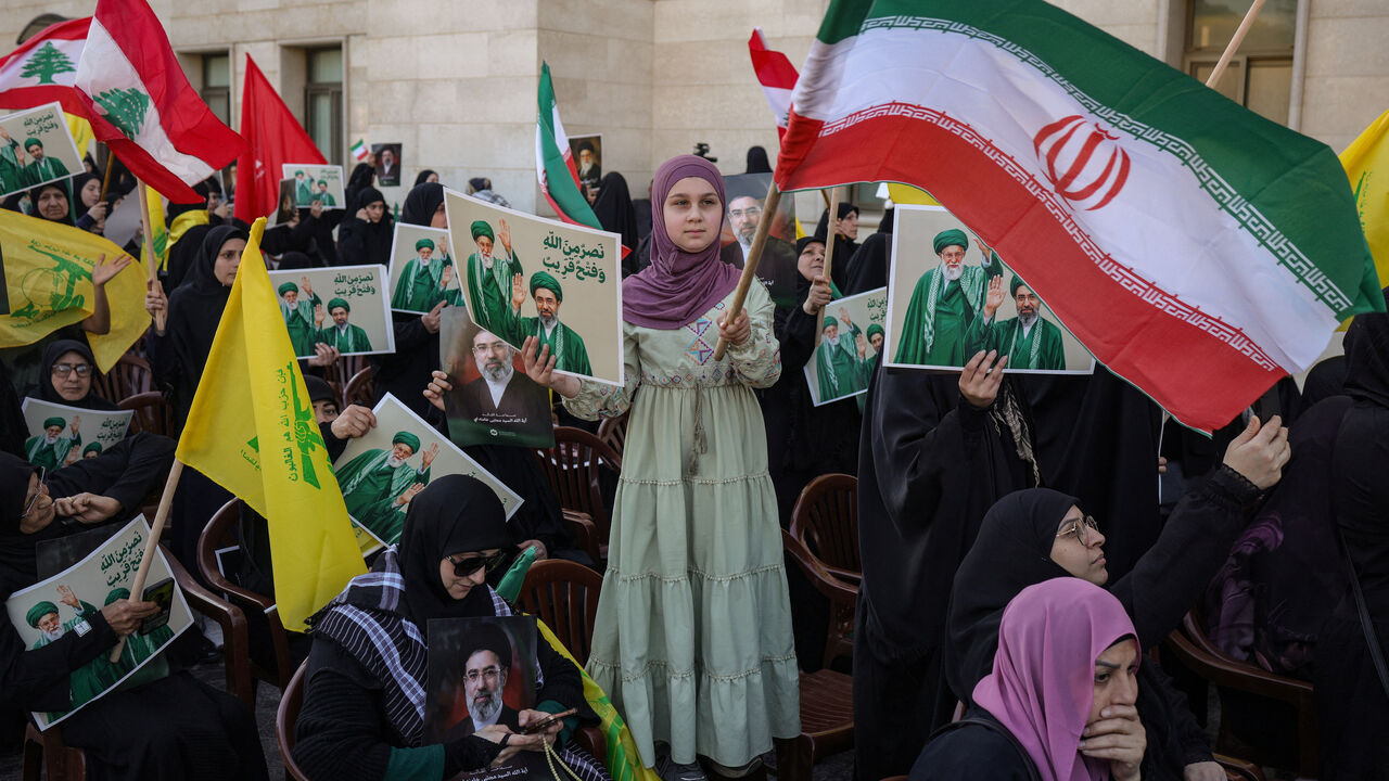 People attend a gathering to pay tribute to Iran’s late Supreme Leader Ayatollah Ali Khamenei and to show support for Iran’s new Supreme Leader Mojtaba Khamenei, inside the Iranian embassy in Beirut, Lebanon, April 22, 2026. REUTERS/Marko Djurica