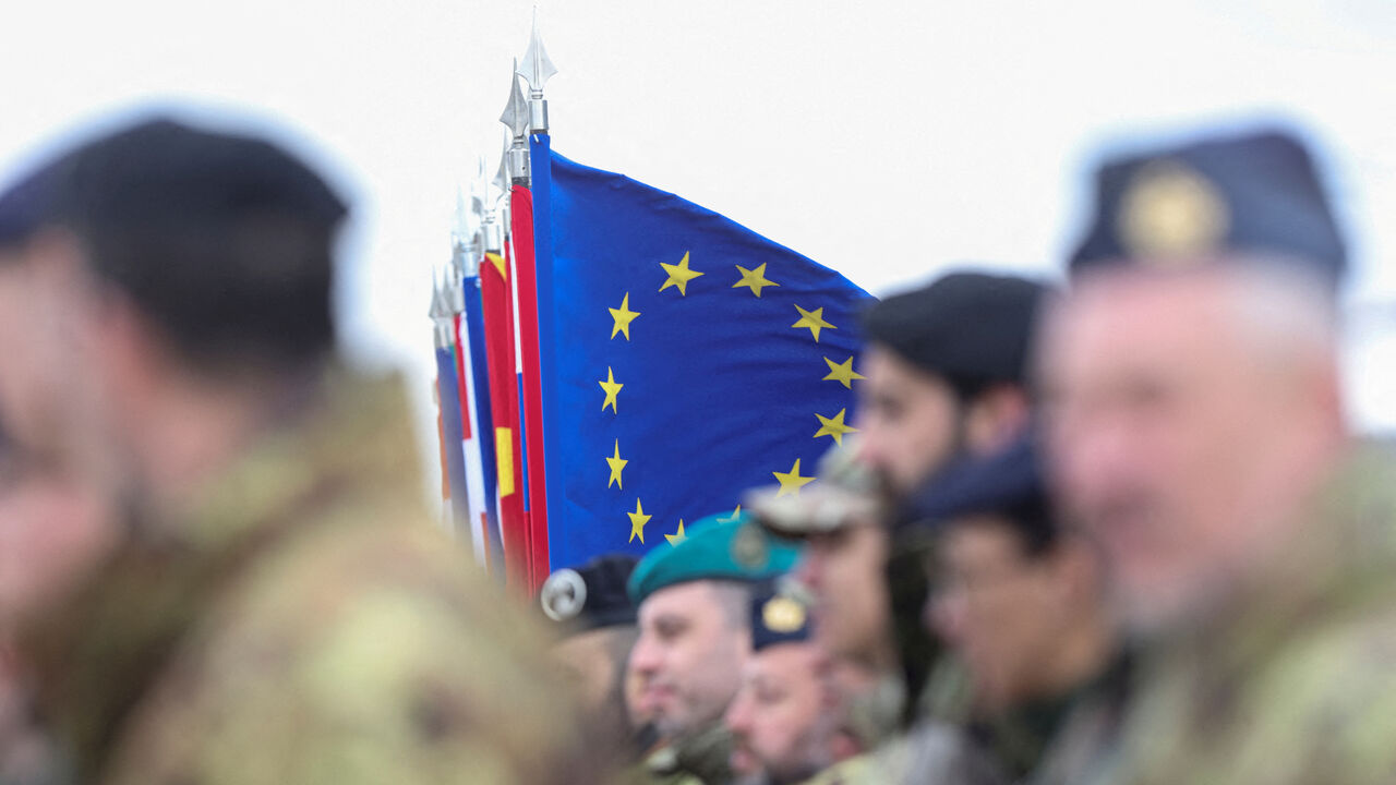 FILE PHOTO: A European Union flag flutters as soldiers of EUFOR (European Union Forces in Bosnia and Herzegovina) stand guard in EUFOR Base Camp in Sarajevo, Bosnia and Herzegovina, April 8, 2025. REUTERS/Amel Emric/File Photo
