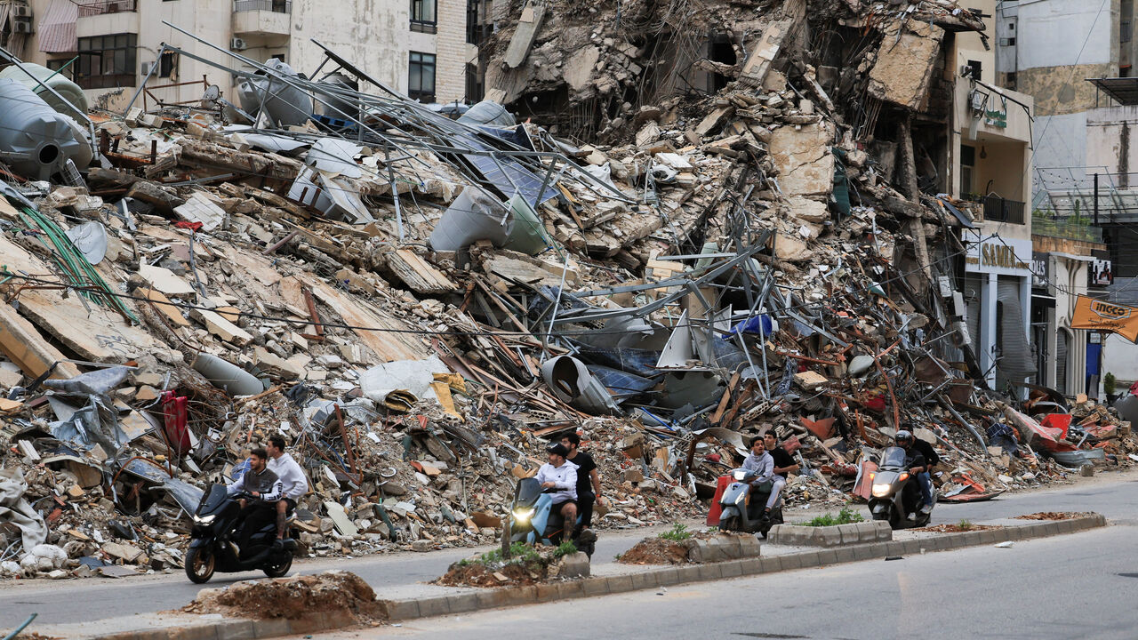 Displaced residents return to their homes after a ceasefire went into effect, in the southern suburbs of Beirut, Lebanon, April 17.   REUTERS/Mohamed Azakir