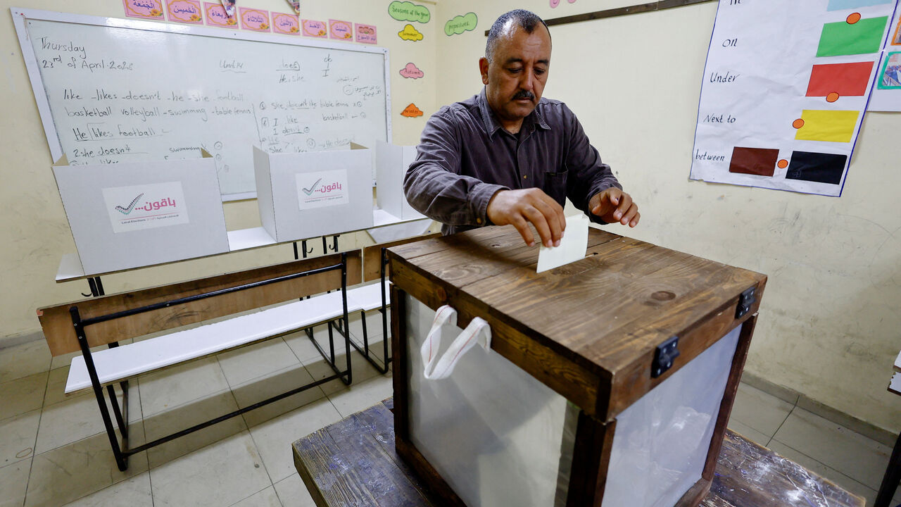 A Palestinian man votes during the municipal election at a polling station in Deir al-Balah, central Gaza Strip April 25, 2026. REUTERS/Mahmoud Issa