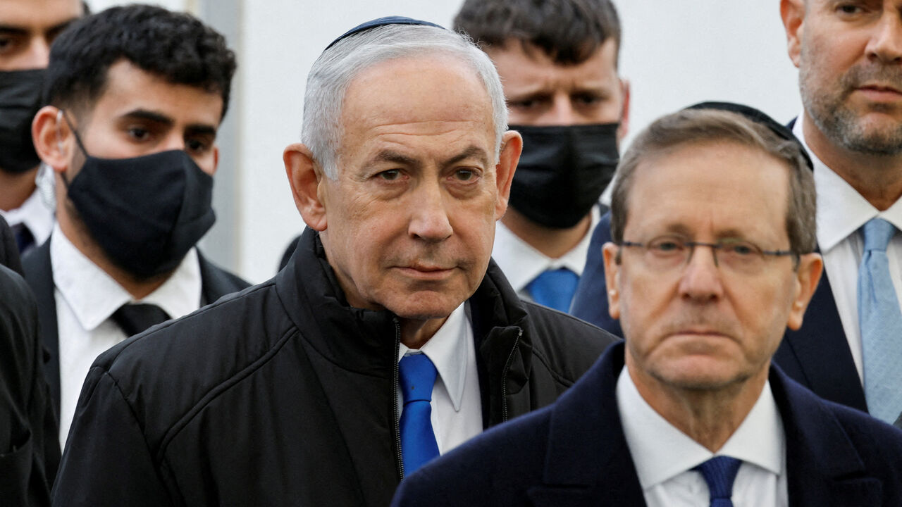FILE PHOTO: Israeli Prime Minister Benjamin Netanyahu and Israeli President Isaac Herzog attend a memorial service, in Meitar, Israel, January 28, 2026. REUTERS/Amir Cohen/File Photo