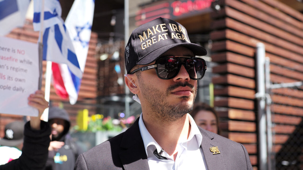 Ali Daneshfar, an operations coordinator with Cyrus the Great, a Toronto-based Iranian group, attends a rally in support of U.S. President Trump's military actions towards Iran, while expressing dissatisfaction with the current ceasefire, in Toronto, Ontario, Canada, April 26, 2026. REUTERS/Wa Lone