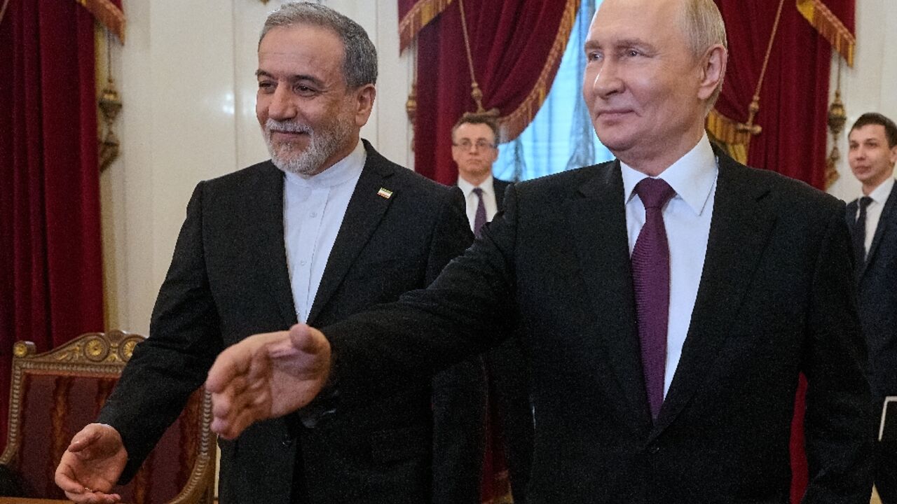 Iranian Foreign Minister Abbas Araghchi (L) met Russian President Vladimir Putin in Saint Petersburg