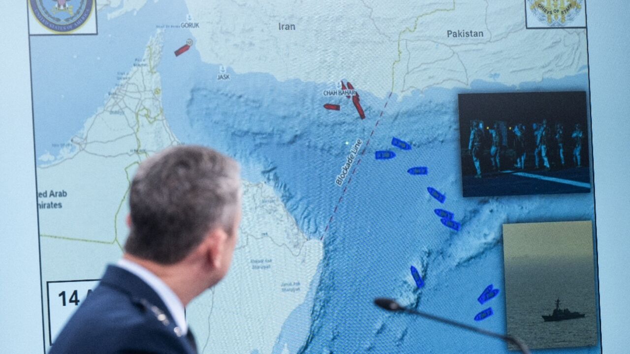 US Chairman of the Joint Chiefs of Staff General Dan Caine shows a map of the Strait of Hormuz at a Pentagon press briefing