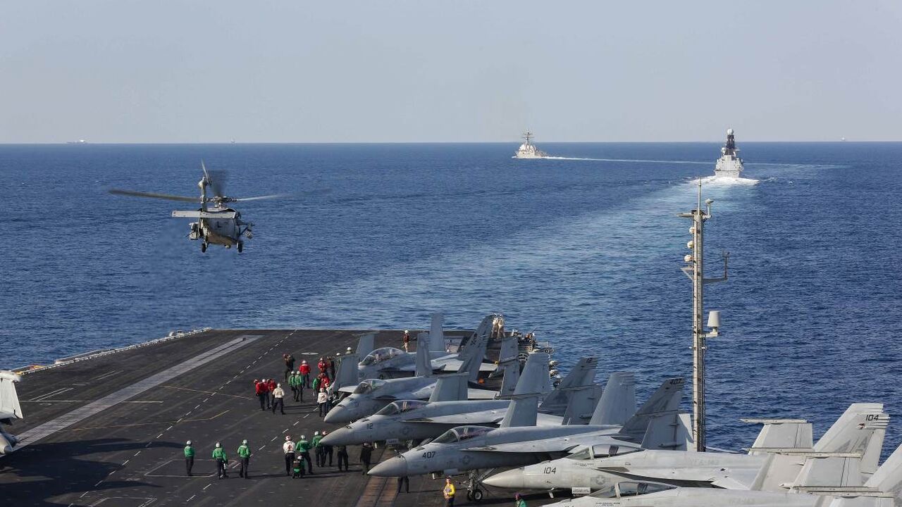 STRAIT OF HORMUZ - NOVEMBER 19: In this handout photo provided by the US Navy, The aircraft carrier USS Abraham Lincoln (CVN 72) transits the Strait of Hormuz as an MH-60S Sea Hawk helicopter from the Nightdippers of Helicopter Sea Combat Squadron (HSC) 5 lifts off from the flight deck November 19, 2019. The Abraham Lincoln Carrier Strike Group is deployed to the U.S. 5th Fleet area of operations in support of naval operations to ensure maritime stability and security in the Central Region, connecting the M