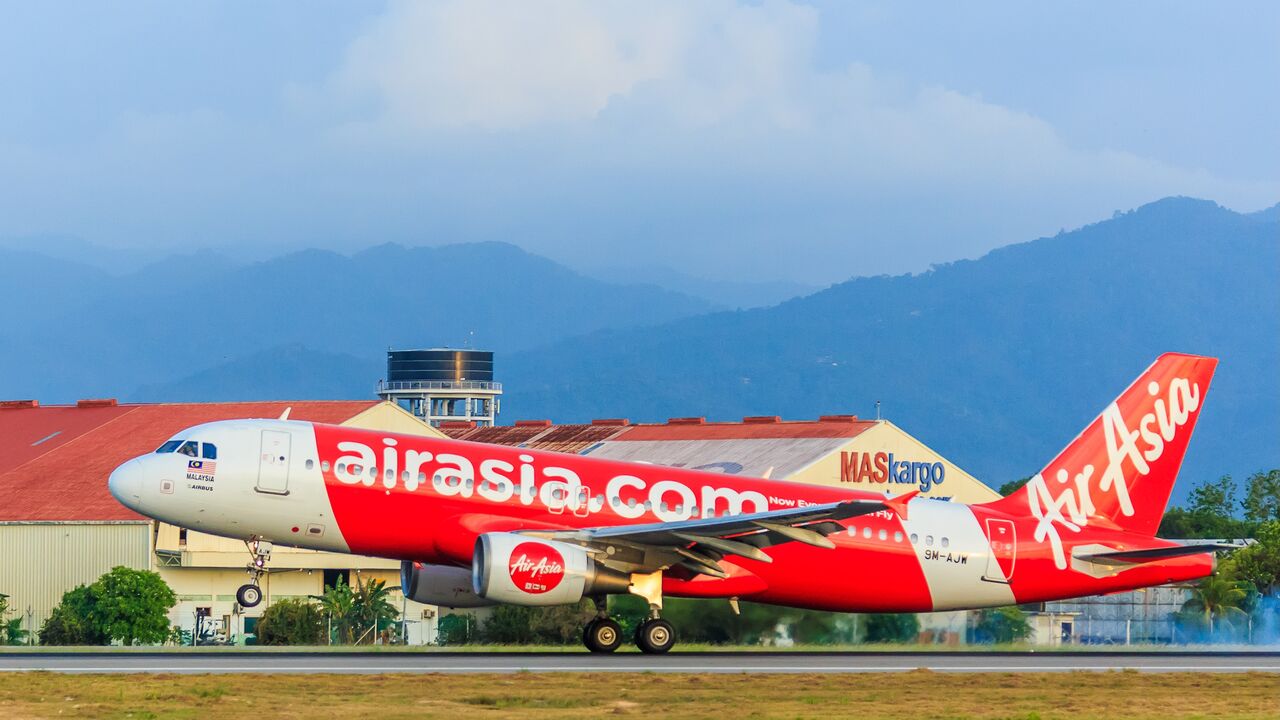 AirAsia aircraft with two engines landing on Kota Kinabalu International airport runway, Kota Kinabalu Sabah, Malaysia, March 4, 2017.