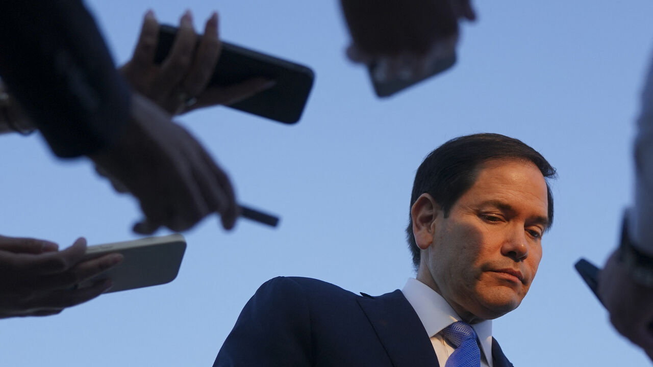 US Secretary of State Marco Rubio speaks to the press as he departs Tel Aviv for Qatar following an official visit, at Ben Gurion International Airport, near Lod, Israel, September 16, 2025. Israel heavily bombarded Gaza City on September 16 2025, witnesses told AFP, after US Secretary of State Marco Rubio backed Israeli Prime Minister Benjamin Netanyahu's new offensive there and its stated goal of eradicating Hamas. (Photo by NATHAN HOWARD / POOL / AFP) (Photo by NATHAN HOWARD/POOL/AFP via Getty Images)