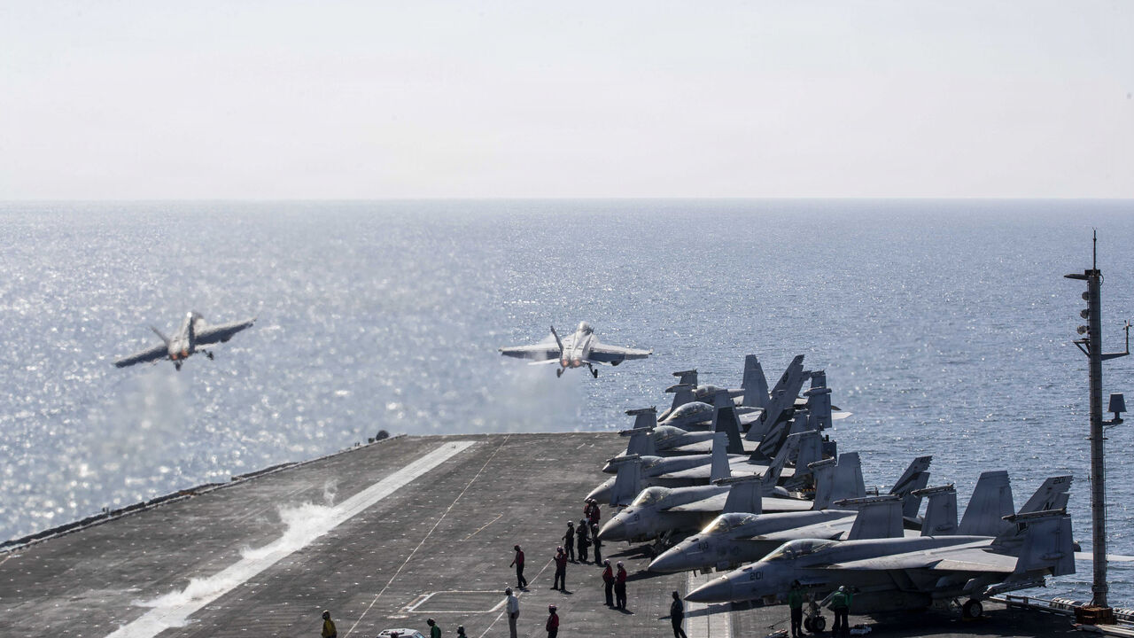 In this handout photo provided by the U.S. Navy, Two F/A-18 Super Hornets launch from the flight deck of Nimitz-class aircraft carrier USS Abraham Lincoln (CVN 72) in support of Operation Epic Fury on March 3, 2026 in the Mediterranean Sea.