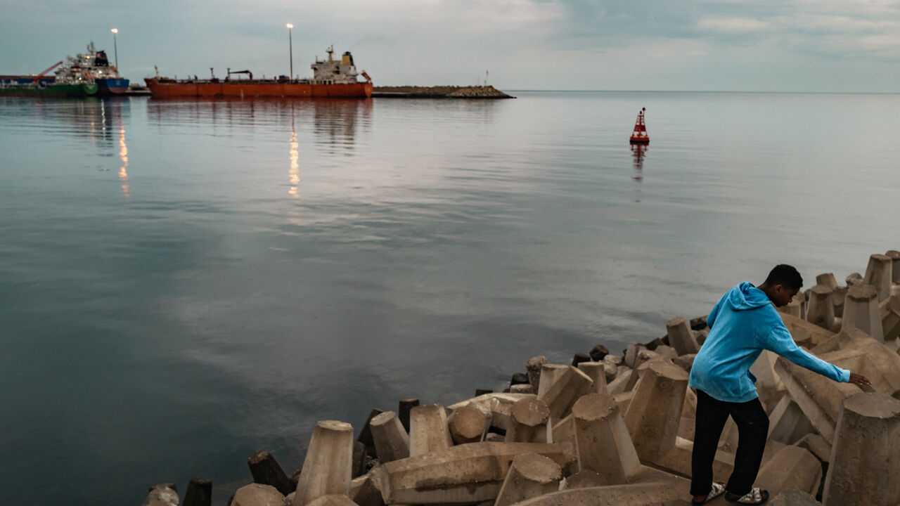 A bulk carrier sits anchored at Sultan Qaboos Port on March 23, 2026 in Muscat, Oman. 