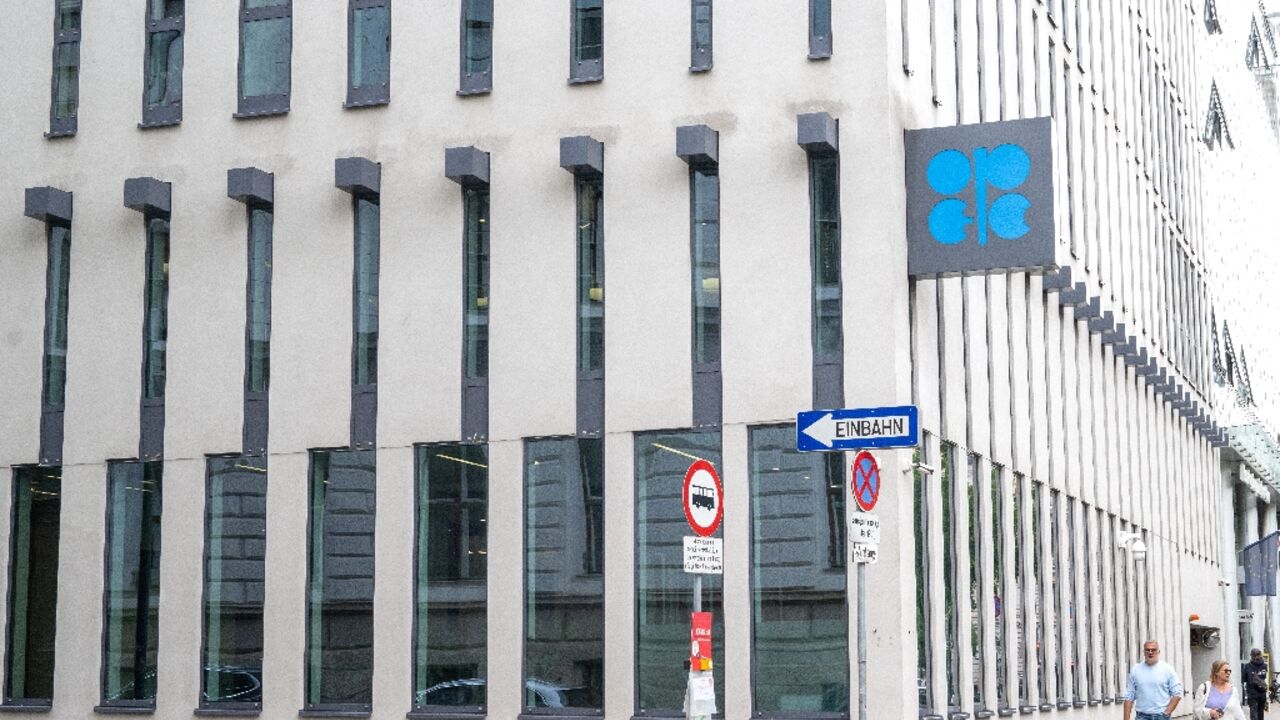 (FILES) People walk by the building headquarters of OPEC (Organization of The Petroleum Exporting Countries) as the logo is seen on its facade in Vienna, Austria