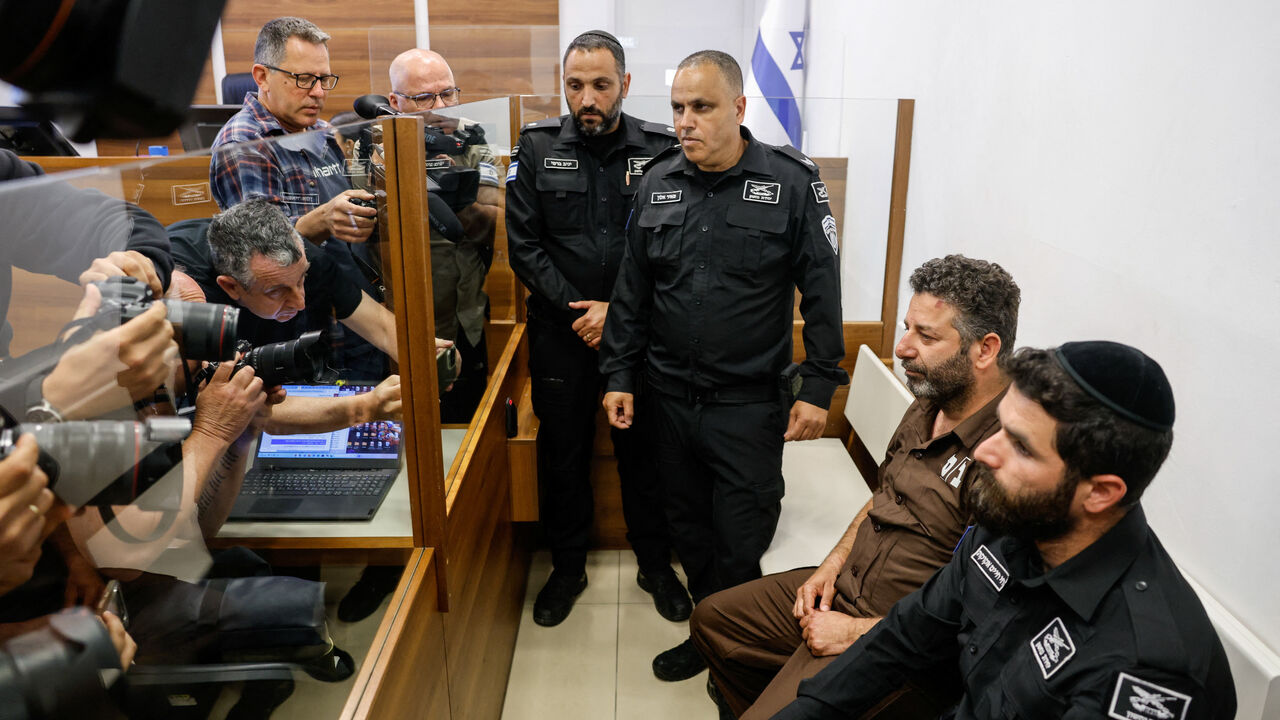 Activist Saif Abu Keshek, a member of the Global Sumud Flotilla detained by Israel, sits at a magistrate's court for a detention extension hearing in Ashkelon, southern Israel, May 3, 2026. REUTERS/Amir Cohen