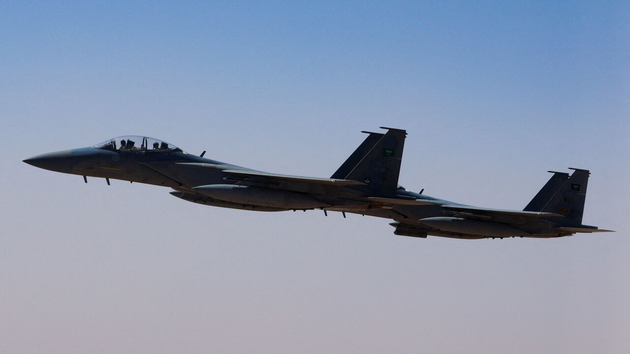 FILE PHOTO: A Saudi fighter jet accompanies Air Force One, carrying U.S. President Donald Trump, on approach to the King Khalid International Airport in Riyadh, Saudi Arabia, May 13, 2025. REUTERS/Brian Snyder/File Photo